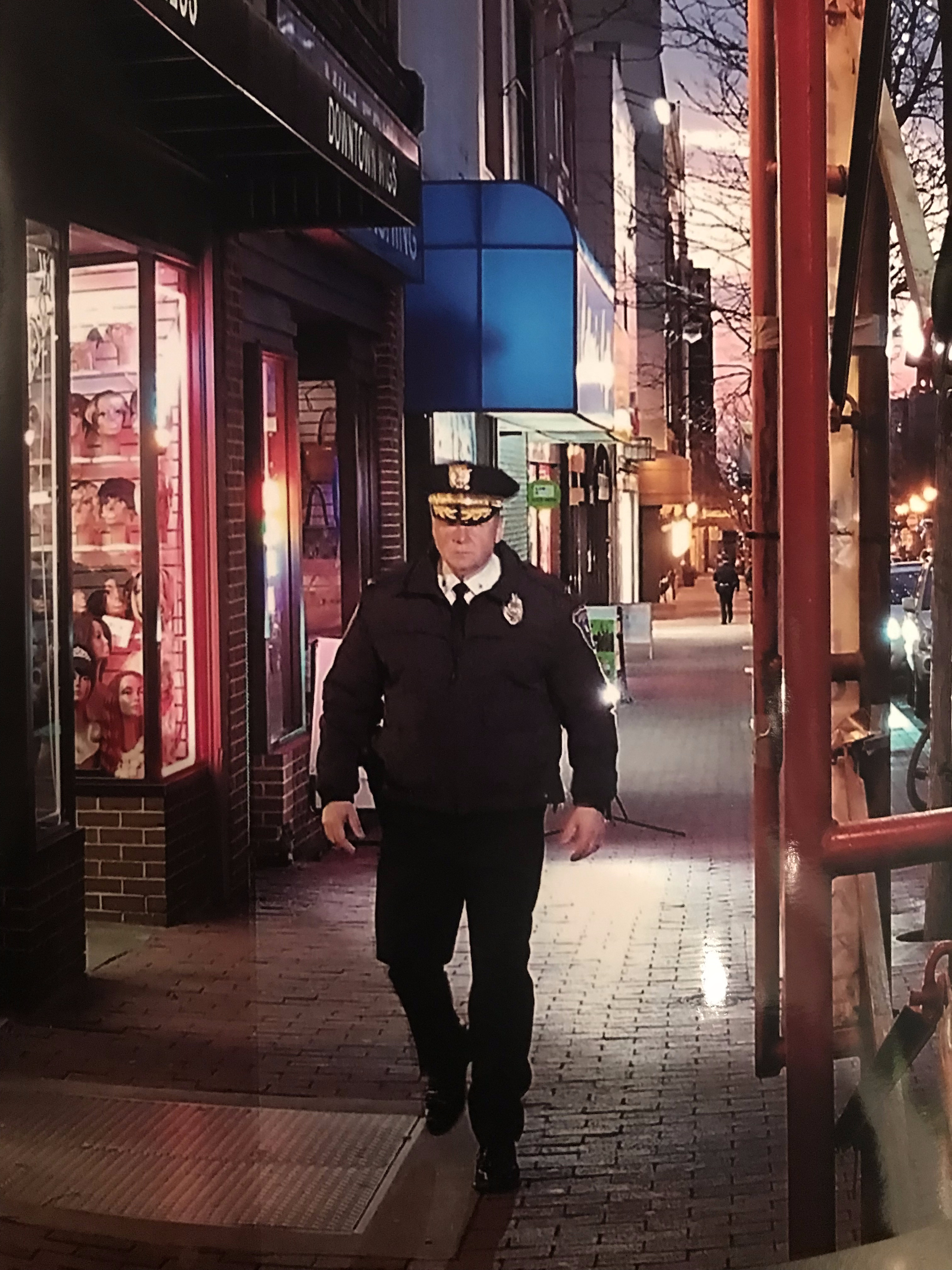 Commissioner Tracy walking the beat at night